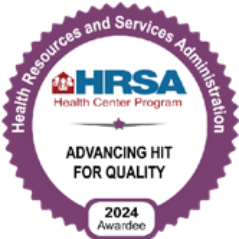 A purple and white badge reads Health Resources and Services Administration, HRSA Health Center Program, Advancing HIT for Quality, 2024 Awardee—recognizing Grand Junction Health Care’s commitment to affordable health care.
