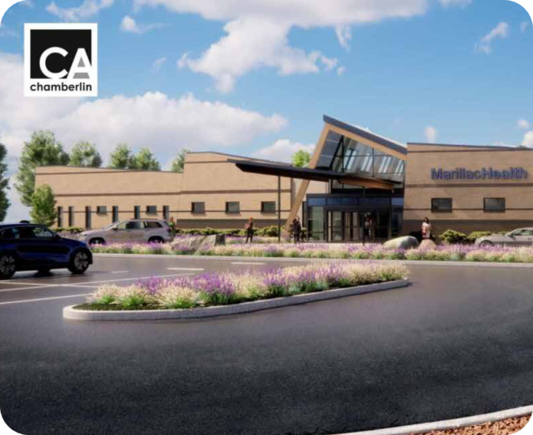 A modern building labeled “MarillacHealth” with large windows and a slanted roof, surrounded by landscaped greenery and a parking lot under a partly cloudy sky, highlights Grand Junction Health Care. A “CA chamberlin” logo is in the top left corner.