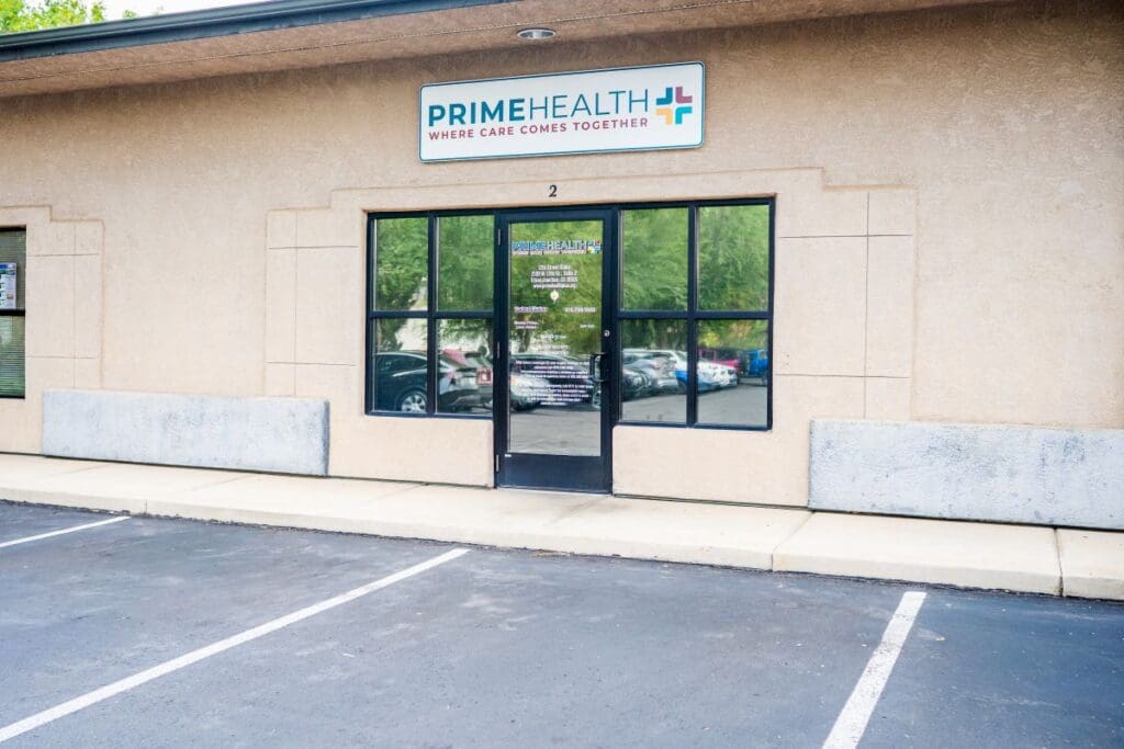 primehealth plus 12th street clinic in grand junction colorado building exterior with front door and signage