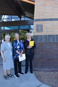 Three Sisters of Charity of Leavenworth beside the PrimeHealth+ building dedication plaque